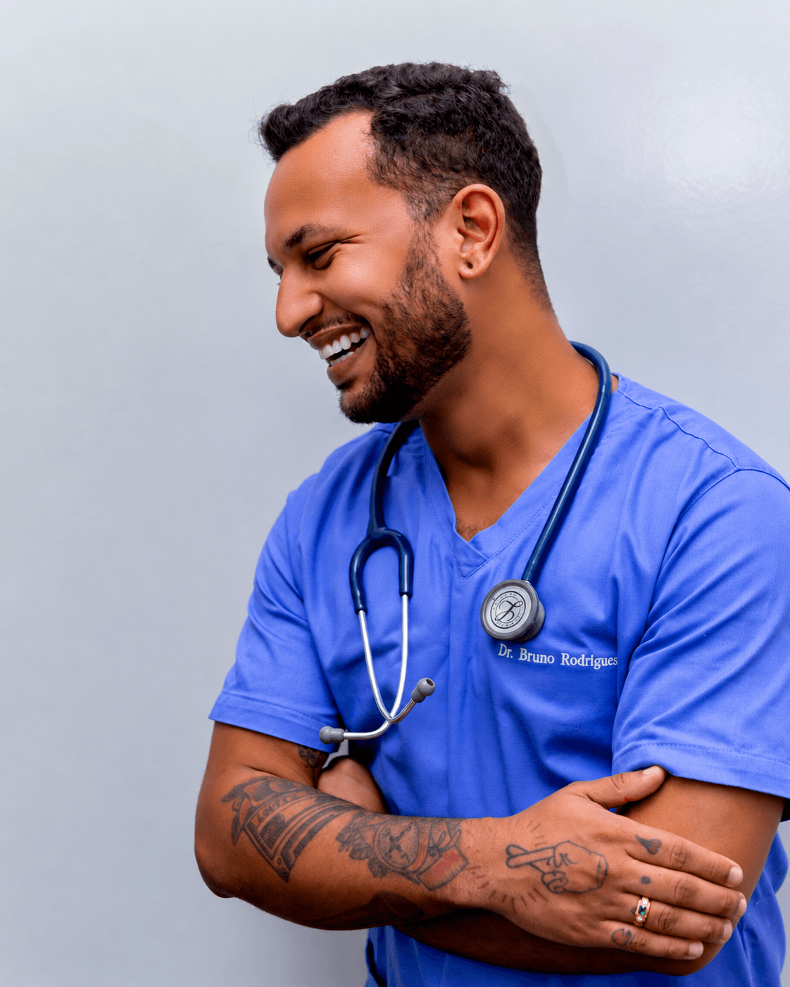 Person wearing blue scrubs with a stethoscope.